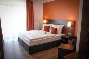 Postel nebo postele na pokoji v ubytování Hotel Rosenhof Garni