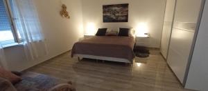 Ένα ή περισσότερα κρεβάτια σε δωμάτιο στο Mia apartman