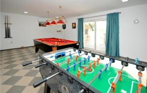 a game room with a pool table and a pool table at Nice Home In Trogir With House Sea View in Trogir
