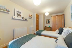 Кровать или кровати в номере 9 Blue Hill Park, Ambleside