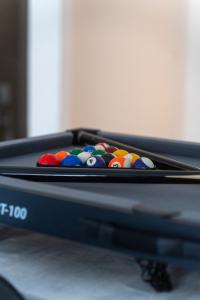 a pool table with billiard balls in it at AeroSerenity in Nouaceur