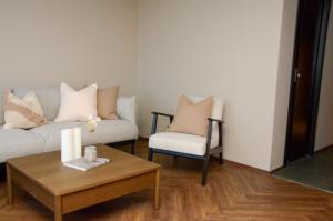 a living room with a couch and a coffee table at Istay - Parkgata 40 in Tromsø
