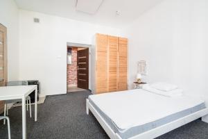 Posteľ alebo postele v izbe v ubytovaní Master Corner Apartment