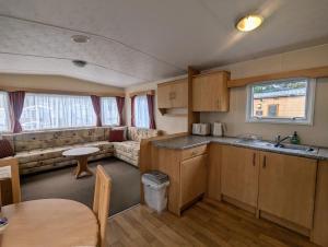 a kitchen and living room of a caravan at No16 The Green in Jedburgh
