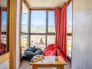 a room with a table and a large window at Apartment Eskival 106 by Interhome in Val Thorens +18 photos