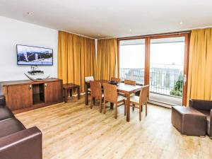 a living room with a table and chairs at Apartment Emma-3 by Interhome in Dürnberg +18 photos