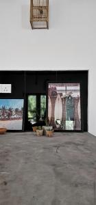 a room with three pictures on the wall at Slow Life Boutique Hotel - Adults Only in Mirissa