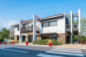 a large white building with a crosswalk at Camping La Plage Argelès in Argelès-sur-Mer