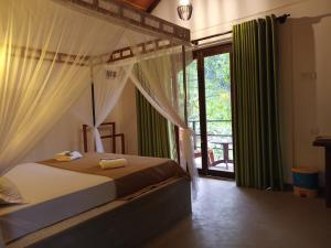 Postel nebo postele na pokoji v ubytování Sunshine Forest Lodge - Sinharaja