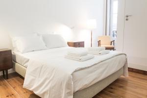 A bed or beds in a room at Porto Republica Hostel & Suites