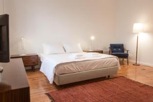 
A bed or beds in a room at Porto Republica Hostel & Suites
