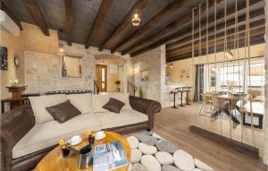 a living room with a couch and a table at Villa Stella Del Lago in Vrana