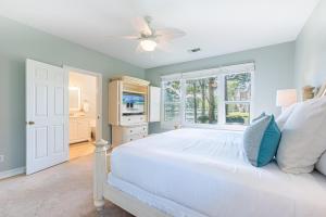 a bedroom with a white bed and a window at Turnberry 8561 in Destin +49 photos