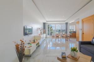 a living room with a couch and a table at New Spacious Apartment 3 Bdr 2 Bth Bugibba S in St Paul's Bay