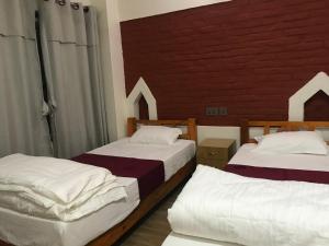 A bed or beds in a room at Mount Fuji Homestay