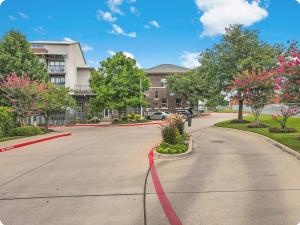 a street in front of a building with a red hose at Vanity 2 Bedroom Loft Downtown Ft Worth in Fort Worth
