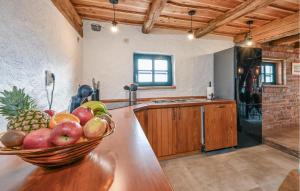a bowl of fruit on a counter in a kitchen at Lovely Home In Lestakovec With Kitchen in Leštakovec