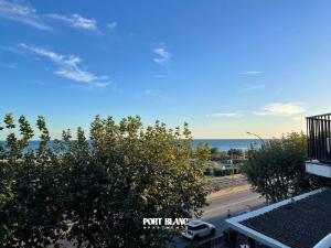 a view of the ocean from the balcony of a condo at PortBlanc Apartments - 4 in Arenys de Mar