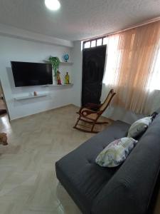 Televisyen dan/atau pusat hiburan di Apartamento Familiar