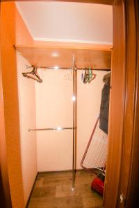 a walk in shower in a small room with at Apartment On Kievskaya 90 in Tomsk
