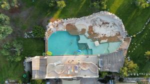 an overhead view of a swimming pool in a park at Sopra i Sassi - Villa & Trulli in Ostuni