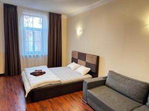 Postel nebo postele na pokoji v ubytování ApartHotel Riga