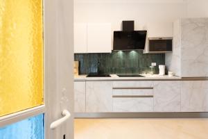 Kuchyň nebo kuchyňský kout v ubytování Gioberti's Apartment - 100 sqm - 2 Bedrooms and Free Private Parking in the Center + 89 fotografií