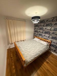 a bedroom with a bed in the corner of a room at Sheffield Serenity in Heeley