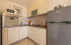 Kuchyňa alebo kuchynka v ubytovaní Apartment Sibenska Vi
