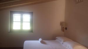 Ein Bett oder Betten in einem Zimmer der Unterkunft Di Luna e Di Sole