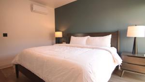Castillo Toscana Hotel Boutique客房内的一张或多张床位