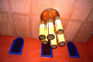 a chandelier hanging from a ceiling with blue windows at Luxury Villa 4500m 4 Bedroom with Big Private Pool in Essaouira