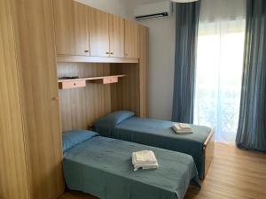 Ένα ή περισσότερα κρεβάτια σε δωμάτιο στο Epical Home Mare