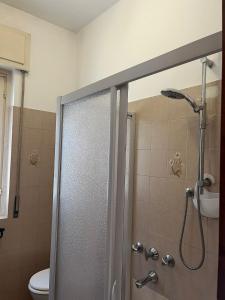 a bathroom with a shower and a toilet at Casa Castel in Civate +13 photos