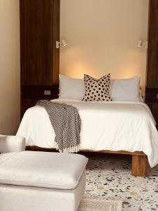 a bedroom with two beds and a couch at Hotel Daleese in Uvita +93 photos