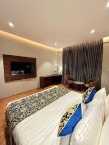 Katil atau katil-katil dalam bilik di The Olive Hotel Srinagar