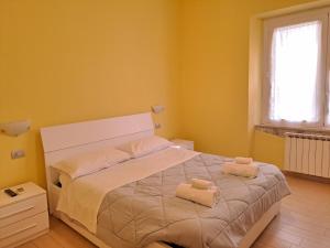 A bed or beds in a room at Appartamento Via Bixio