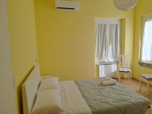 A bed or beds in a room at Appartamento Via Bixio