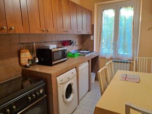 A kitchen or kitchenette at Appartamento Via Bixio