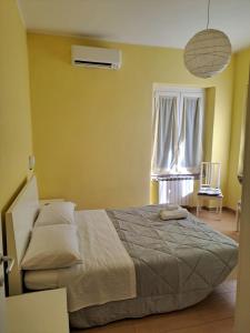 A bed or beds in a room at Appartamento Via Bixio