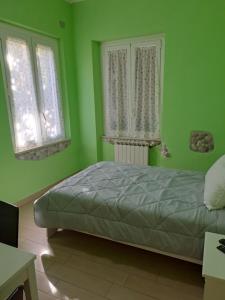 A bed or beds in a room at Appartamento Via Bixio