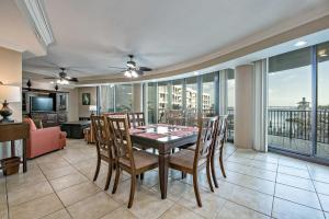 a dining room with a table and chairs at Phoenix on the Bay II 2212 in Orange Beach