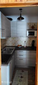 Kuchyň nebo kuchyňský kout v ubytování Monolocale situato in zona tranquilla + 5 fotografií