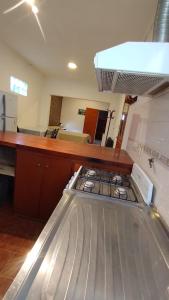 a kitchen with a stove top in a room at Departamentos Mercedes VM in Villa Mercedes