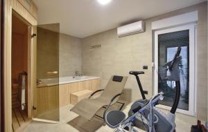 a home gym with a bike and a treadmill at Beautiful Home In Omis With Sauna in Omiš