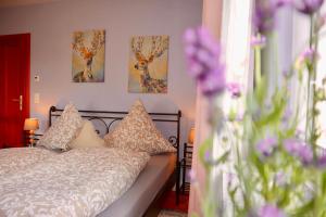 a bedroom with a bed with pillows on it at Ferienhaus Schwarzwald Feldberg Falkau in Feldberg