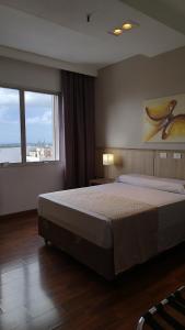 Cama o camas de una habitación en Hotel Nacional Inn Porto Alegre - Próximo ao Complexo Hospitalar Santa Casa e UFRGS