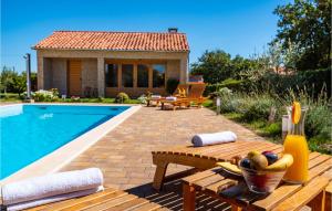 a backyard with a pool and a table with bananas on it at Four-Bedroom Holiday Home In Suhovare in Suhovare