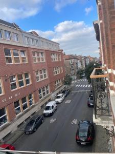 a view of a city street with cars and buildings at Attic European Quarter in Brussels