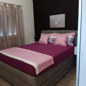 Кровать или кровати в номере Apartmani Zoran